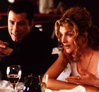 John Travolta as Chili Palmer and Rene Russo as Karen Flores on Get Shorty