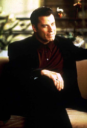 John Travolta as Chili Palmer in Get Shorty
